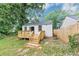 Charming backyard features wooden deck with convenient access to the well-maintained yard at 942 Lawton Sw St, Atlanta, GA 30310