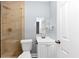 Stylish bathroom features a modern shower and vanity, creating a clean and functional space at 942 Lawton Sw St, Atlanta, GA 30310