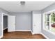 Bedroom with neutral gray walls, new gray paint, and wood floors at 942 Lawton Sw St, Atlanta, GA 30310