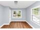 Inviting bedroom featuring wood flooring and plenty of natural light at 942 Lawton Sw St, Atlanta, GA 30310