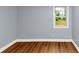 Neutral bedroom with new gray paint, wood flooring, and natural light at 942 Lawton Sw St, Atlanta, GA 30310