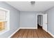 Cozy bedroom featuring wood flooring and a new gray paint at 942 Lawton Sw St, Atlanta, GA 30310