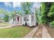 An angled view showcasing the side yard and updated exterior of the home at 942 Lawton Sw St, Atlanta, GA 30310