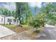The residence offers a charming curb appeal with landscaped front yard, and cozy home exterior at 942 Lawton Sw St, Atlanta, GA 30310