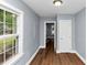 Hallway with new floors and a view into another room through the doorway at 942 Lawton Sw St, Atlanta, GA 30310