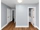 Hallway showing doors, access to bathroom, and new gray walls at 942 Lawton Sw St, Atlanta, GA 30310