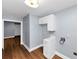 Bright laundry area featuring a utility sink and gray wall at 942 Lawton Sw St, Atlanta, GA 30310