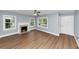 Bright living room featuring a fireplace, large windows, and modern flooring at 942 Lawton Sw St, Atlanta, GA 30310