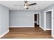 Living space featuring hardwood floors, neutral paint, and access to the bathroom at 942 Lawton Sw St, Atlanta, GA 30310