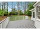 Spacious backyard deck with white railings overlooking a lush, green lawn and mature trees at 1275 Mayfield Rd, Milton, GA 30009