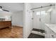 Modern bathroom featuring a tiled shower and a view into the bedroom at 1275 Mayfield Rd, Milton, GA 30009