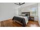 Bright bedroom featuring hardwood floors, a queen bed, and ample natural light at 1275 Mayfield Rd, Alpharetta, GA 30009