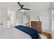 Bedroom with wood floors, built in bench, and white walls at 1275 Mayfield Rd, Milton, GA 30009