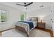 Bright bedroom featuring hardwood floors, white walls, two windows and neutral rug at 1275 Mayfield Rd, Alpharetta, GA 30009