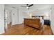 Primary bedroom featuring hardwood floors and a classic sleigh bed at 1275 Mayfield Rd, Milton, GA 30009