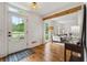 Inviting entryway with hardwood floors, connecting to the living room and featuring a glass-paned front door at 1275 Mayfield Rd, Alpharetta, GA 30009