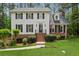 Charming two-story home with brick accents, black shutters, and a well-manicured lawn and front garden at 1275 Mayfield Rd, Milton, GA 30009