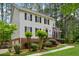 Beautiful two-story home with a brick foundation, black shutters, and a manicured lawn surrounded by trees at 1275 Mayfield Rd, Milton, GA 30009