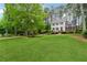 Spacious front yard showcasing a two-story home with brick accents, black shutters, and a well-kept lawn at 1275 Mayfield Rd, Milton, GA 30009