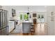 Spacious kitchen with a large island, white cabinets, stainless steel appliances, and hardwood floors at 1275 Mayfield Rd, Alpharetta, GA 30009