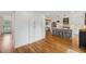 Spacious kitchen featuring hardwood floors, white cabinets, and stainless steel appliances at 1275 Mayfield Rd, Milton, GA 30009