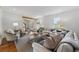 Bright living room with large windows, hardwood floors, comfortable seating, and stylish decor at 1275 Mayfield Rd, Milton, GA 30009