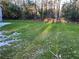 Grassy backyard with lush green lawn and mature trees at 274 Fairburn Nw Rd, Atlanta, GA 30331