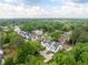 Aerial view of neighborhood featuring lush green trees, sidewalks, and well-maintained homes at 2761 Mathews St, Smyrna, GA 30080