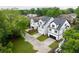 Aerial view of new modern homes with driveways, lawns, and mature trees at 2761 Mathews St, Smyrna, GA 30080