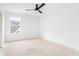 Bedroom featuring white walls, ceiling fan, and a window offering natural light at 2761 Mathews St, Smyrna, GA 30080