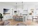 Open-concept kitchen with modern island, pendant lighting, and stainless steel appliances at 2761 Mathews St, Smyrna, GA 30080