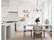 Bright eat-in kitchen featuring white cabinets, stainless appliances, and a stylish dining area at 2761 Mathews St, Smyrna, GA 30080