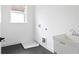 Convenient laundry room featuring a utility sink and modern fixtures at 2761 Mathews St, Smyrna, GA 30080