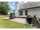 Exterior of the house with patio, grill, landscaping, and white chimney at 725 Danbridge Way, Roswell, GA 30076