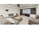 Basement media room with comfortable sectional sofa, projector and large screen at 725 Danbridge Way, Roswell, GA 30076