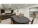 Basement featuring a media area with projector screen, kitchenette and a dining area at 725 Danbridge Way, Roswell, GA 30076