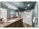 Charming bathroom with a large vanity, elegant mirror, and shower with glass doors at 725 Danbridge Way, Roswell, GA 30076