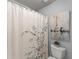 Shower-tub combo with a patterned shower curtain at 725 Danbridge Way, Roswell, GA 30076