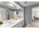 Bathroom boasts double vanity, framed mirrors, and views to an adjacent bedroom at 725 Danbridge Way, Roswell, GA 30076