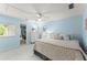 Charming bedroom with light blue walls, plush carpet, ceiling fan, and an attached sitting area at 725 Danbridge Way, Roswell, GA 30076