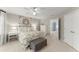Bright bedroom featuring neutral walls, plush carpet, ceiling fan, and an ensuite bathroom at 725 Danbridge Way, Roswell, GA 30076