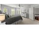 Bright bedroom with a neutral palette features large windows, a ceiling fan and a decorative dresser at 725 Danbridge Way, Roswell, GA 30076