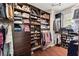 Organized walk-in closet with ample storage for clothing, shoes, and accessories at 725 Danbridge Way, Roswell, GA 30076