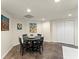 Cozy dining area featuring a round table, stylish art, and lots of bright light at 725 Danbridge Way, Roswell, GA 30076