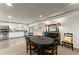 Inviting dining room featuring stylish black furniture and an open flow to the bright kitchen at 725 Danbridge Way, Roswell, GA 30076