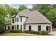 Charming two-story home with a manicured lawn and beautiful landscaping at 725 Danbridge Way, Roswell, GA 30076