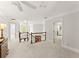Bright hallway with carpet flooring, beautiful chandelier, and ample natural light from the large arched window at 725 Danbridge Way, Roswell, GA 30076