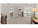 Hallway boasts a charming bookcase and wrought iron railing overlooking the main level at 725 Danbridge Way, Roswell, GA 30076