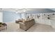 Spacious living area featuring plush seating, built-in shelving and soft blue walls at 725 Danbridge Way, Roswell, GA 30076