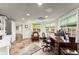 Spacious home office with natural light, a comfortable seating area, and a well-equipped workspace at 725 Danbridge Way, Roswell, GA 30076